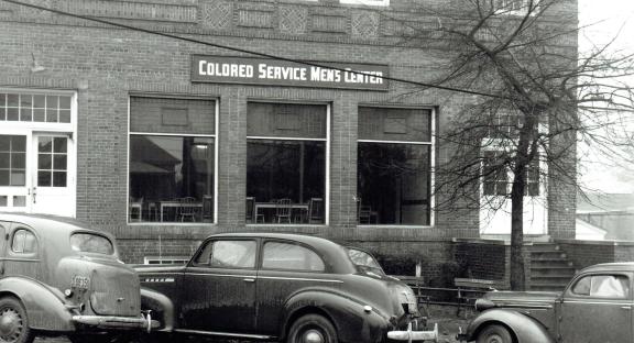 During World War II, the Greenville Army Airbase, later Donaldson Center, was built in the southern part of the county. Because the airbase was segregated, the USO for colored soldiers was housed at the Phillis Wheatley Center. The library presence there was severely curtailed; hours were slashed and materials reduced.  (Image from the Coxe Collection, courtesy of the Greenville County Historical Society)