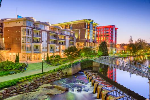 Shops, restaurants, and hotels by Greenville’s Reedy River
