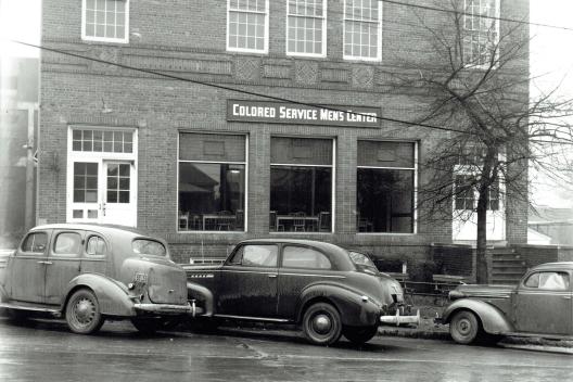 During World War II, the Greenville Army Airbase, later Donaldson Center, was built in the southern part of the county. Because the airbase was segregated, the USO for colored soldiers was housed at the Phillis Wheatley Center. The library presence there was severely curtailed; hours were slashed and materials reduced. (Image from the Coxe Collection, courtesy of the Greenville County Historical Society)